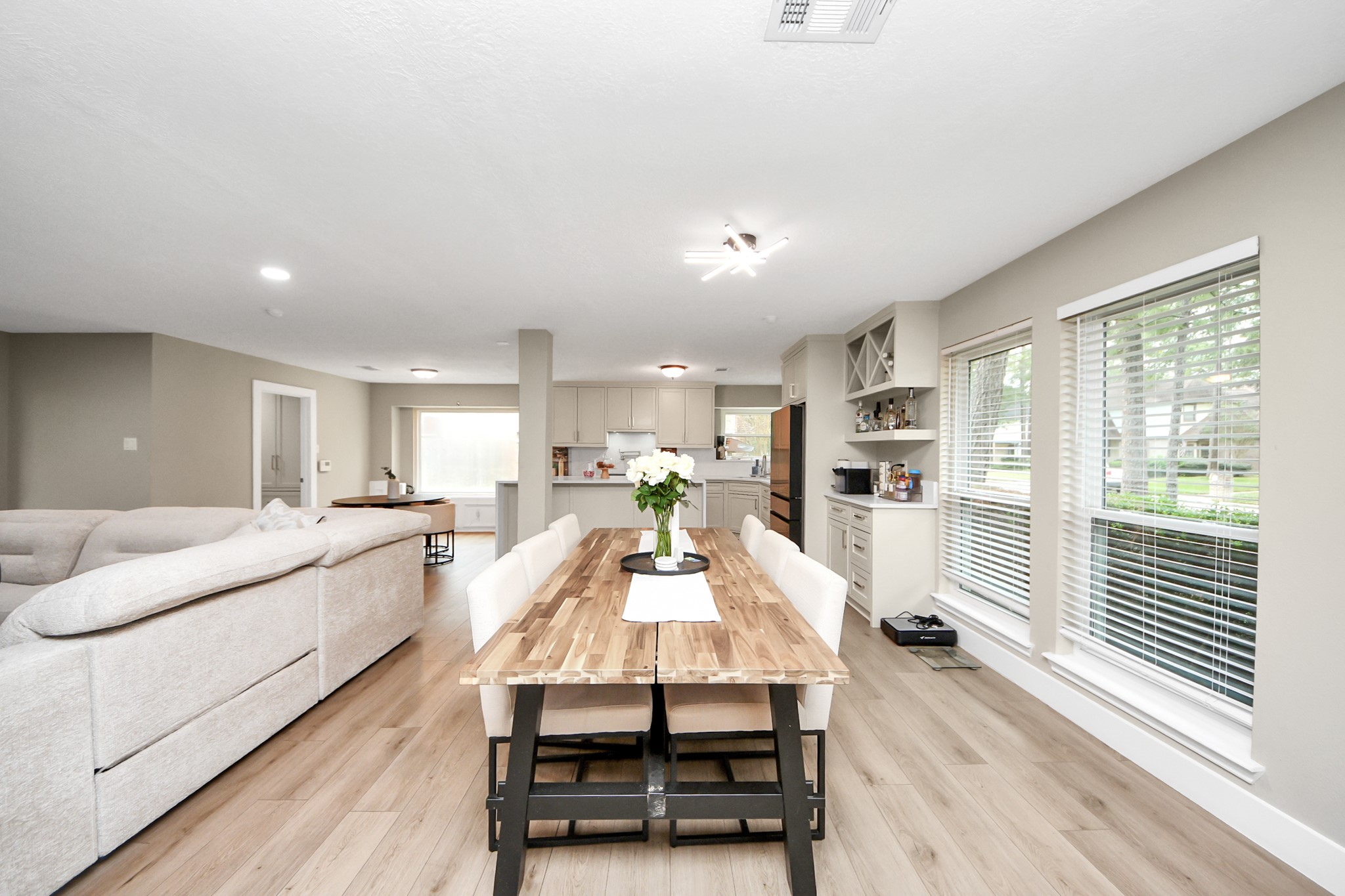 5511 Lacreek Lane Spring, TX 77379 - Photo 10 of 39 a living room with stainless steel appliances furniture a rug kitchen view and a large window