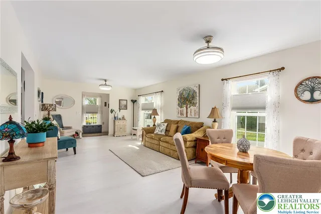 a living room with furniture and a chair