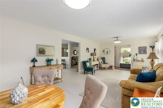 a view of a livingroom with furniture and a flat screen tv