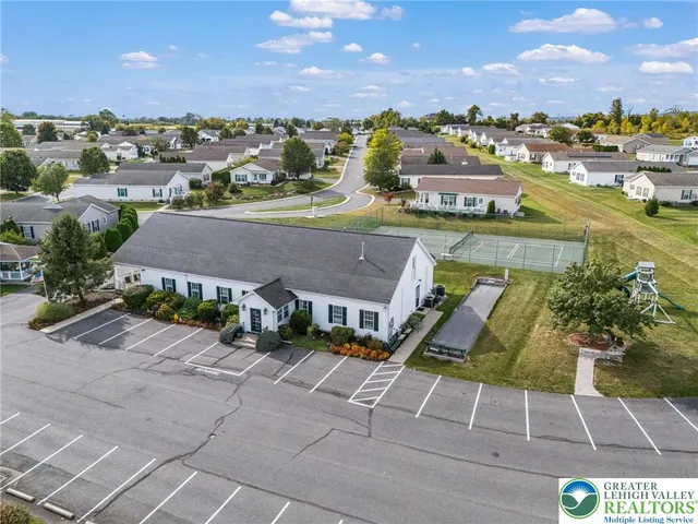 an aerial view of residential houses with outdoor space