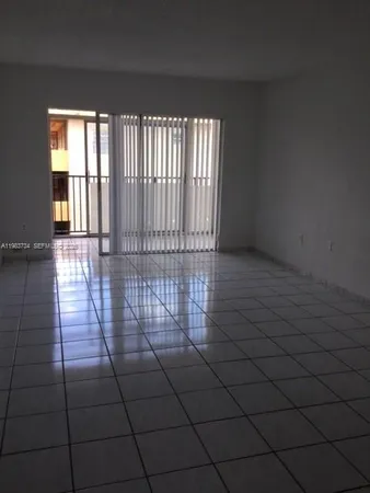 en empty room with windows