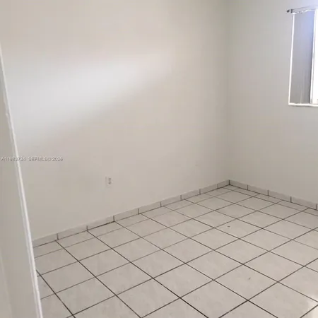 a view of a room and window