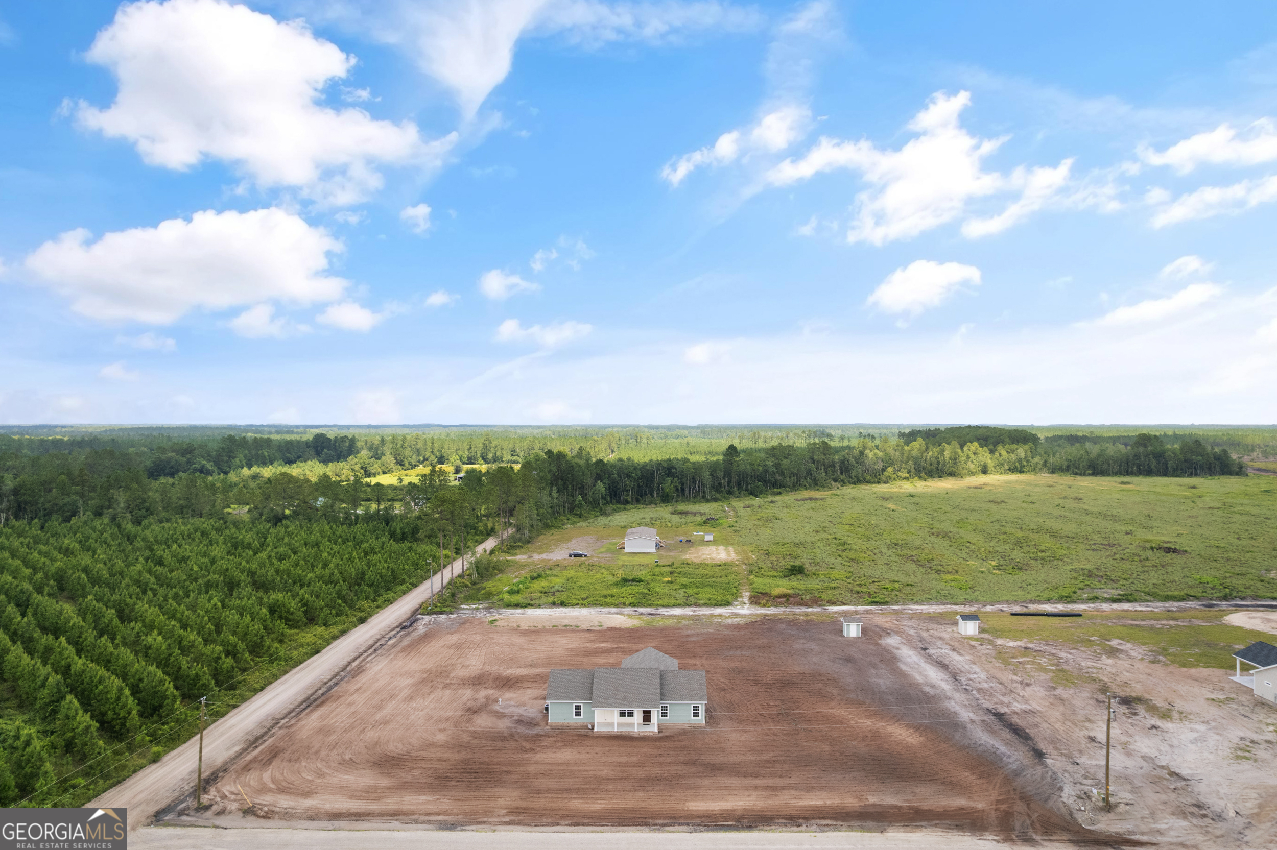 a view of a yard and front view of a house