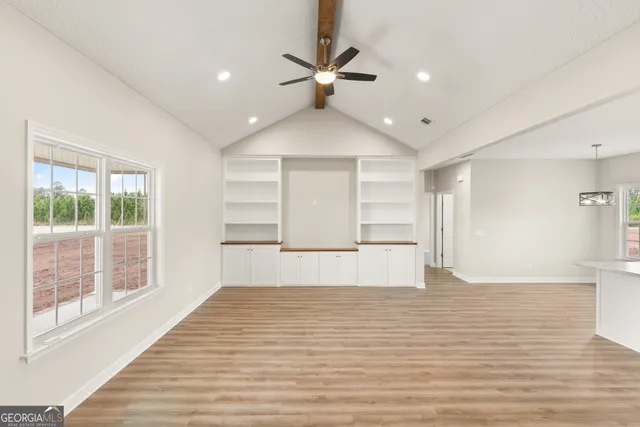 a view of an empty room with a window