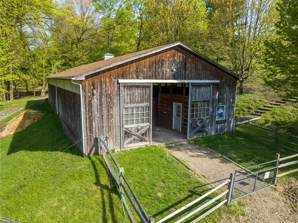 a view of yard with swimming pool and trees