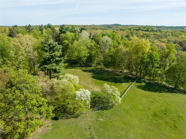 a view of a lake with a yard