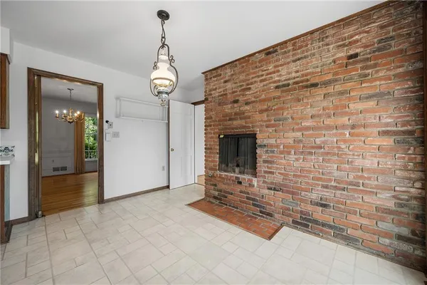 a kitchen with a stove a sink a refrigerator and a window