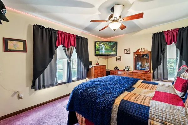 a bedroom with a bed and a dresser