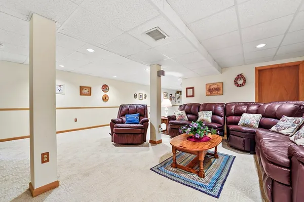 a living room with furniture and a rug