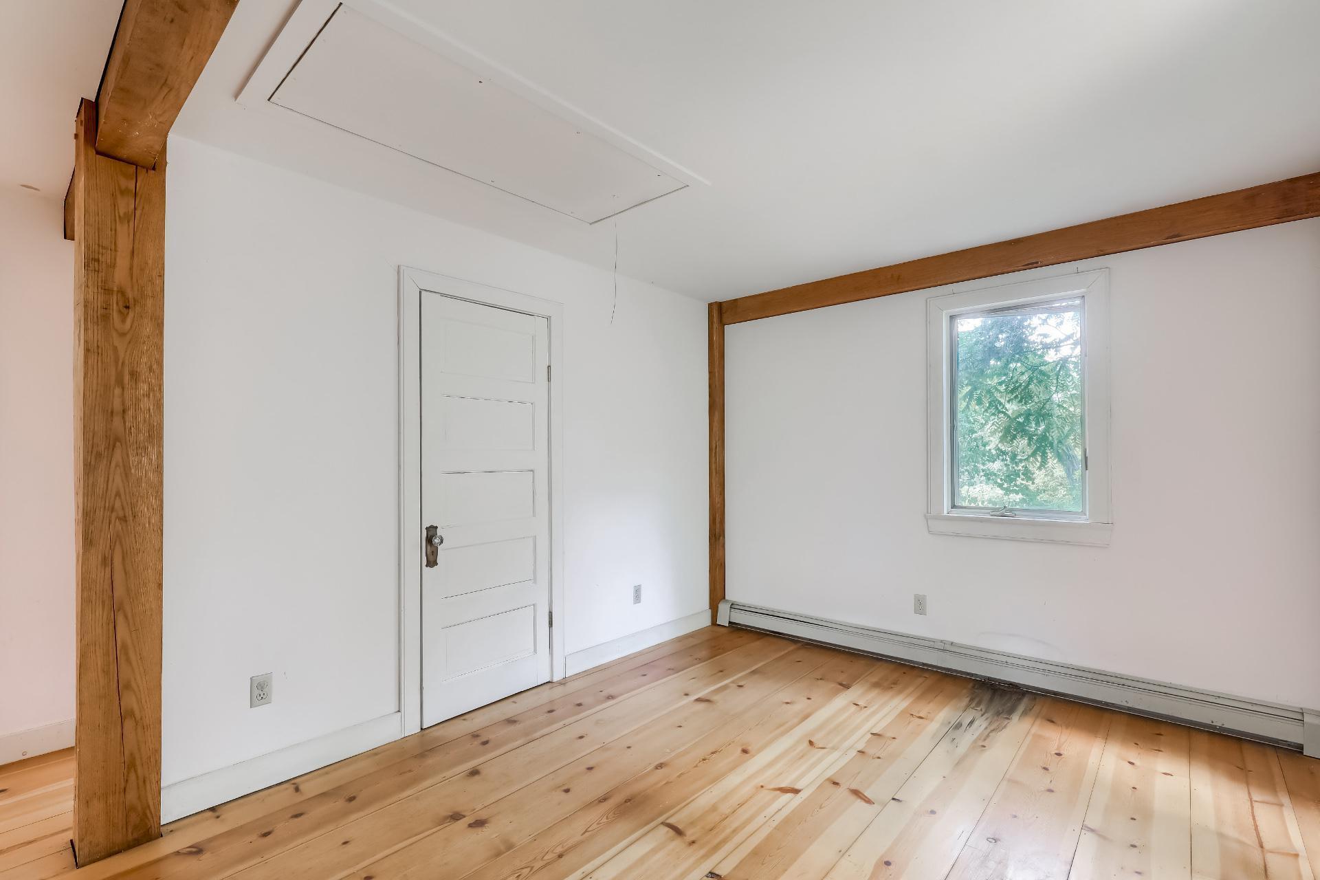 309 Great Fields Road Brewster, MA 02631 - Photo 13 of 23 a view of an empty room with wooden floor and a window