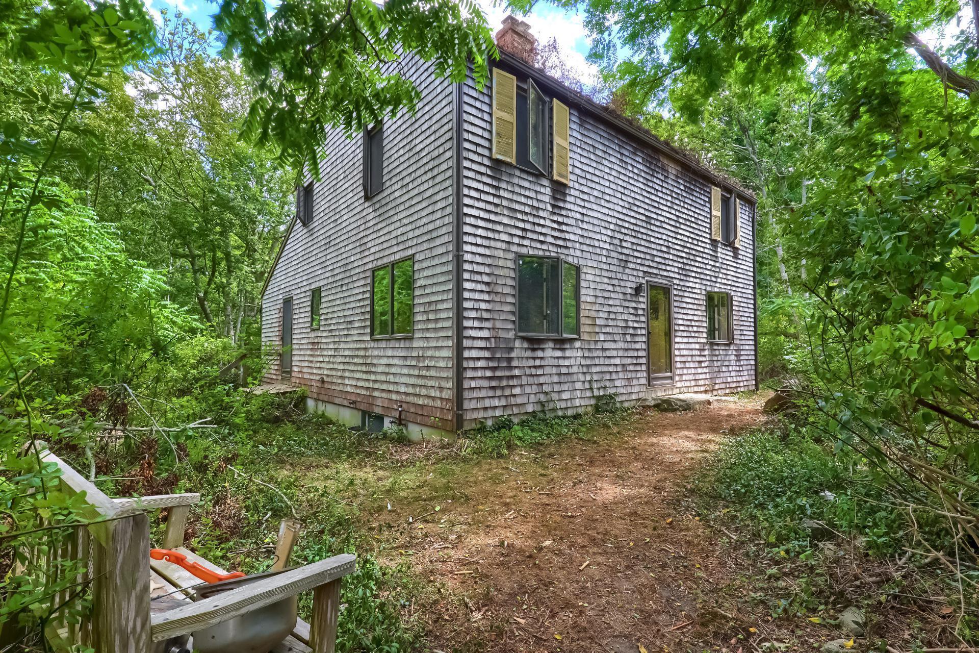309 Great Fields Road Brewster, MA 02631 - Photo 19 of 23 a view of a house with a yard