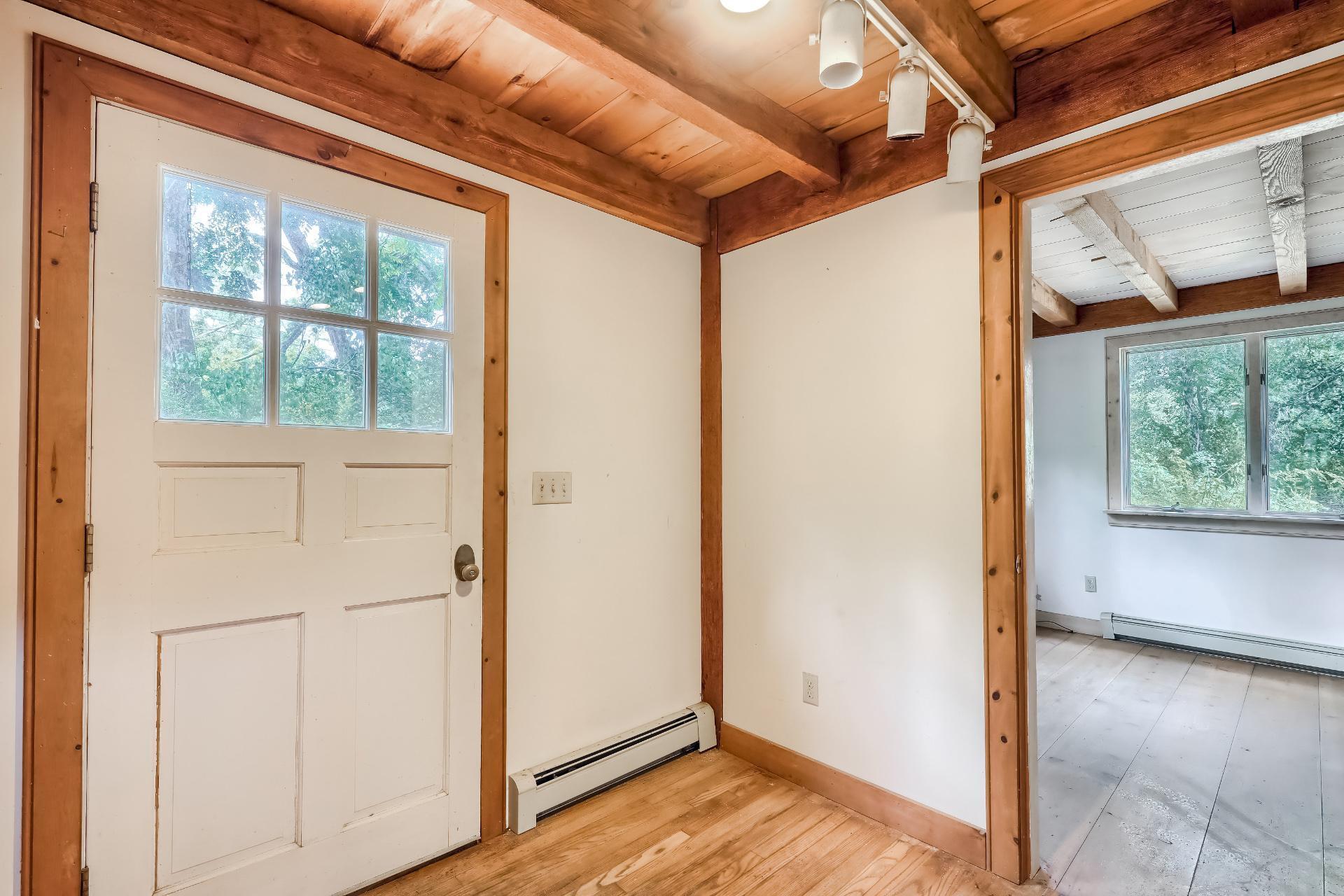 309 Great Fields Road Brewster, MA 02631 - Photo 5 of 23 a view of a room with wooden floor and windows