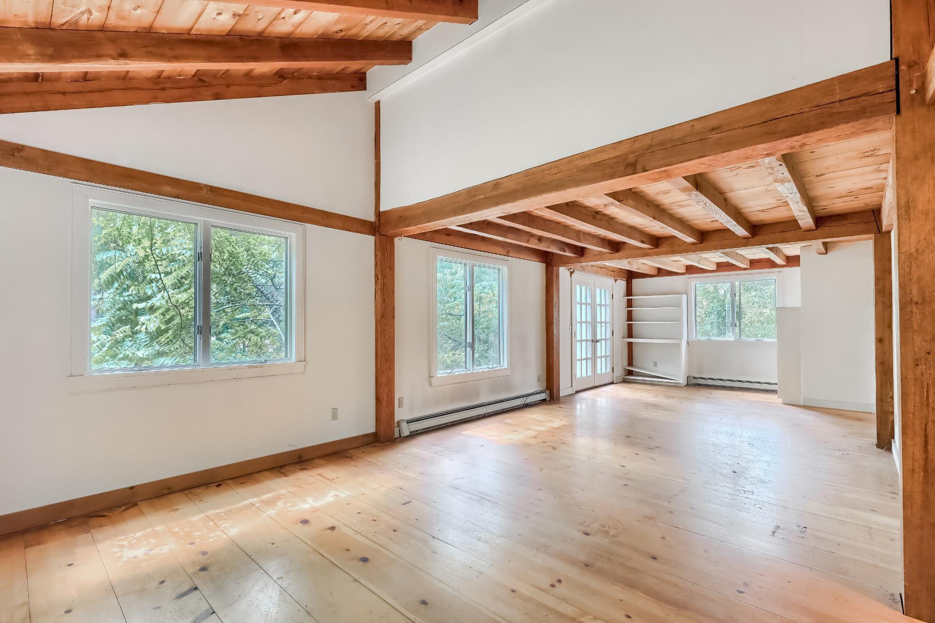 309 Great Fields Road Brewster, MA 02631 - Photo 9 of 23 a view of a room with wooden floor and windows