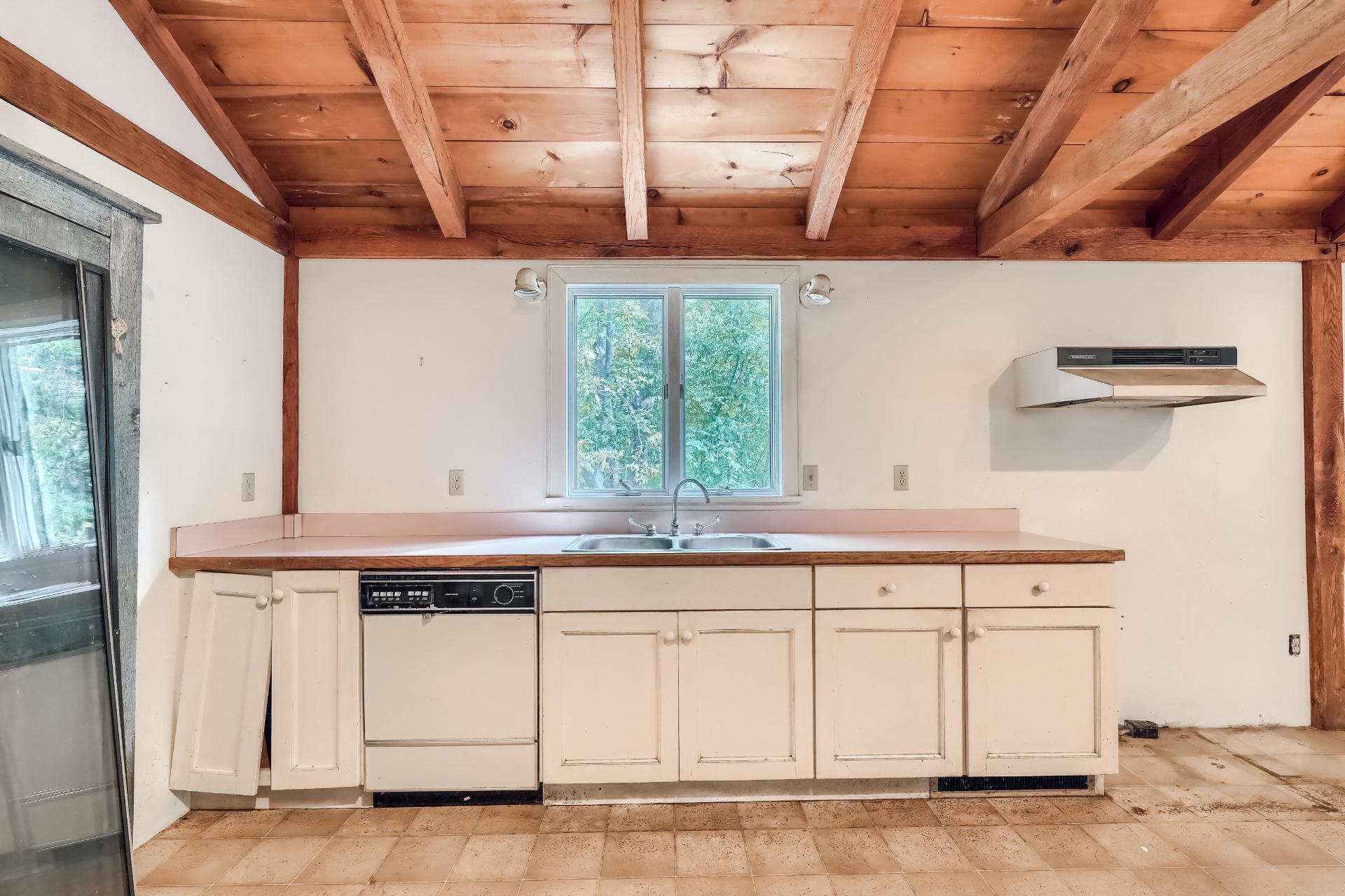 309 Great Fields Road Brewster, MA 02631 - Photo 10 of 23 a view of a kitchen with a sink and cabinets