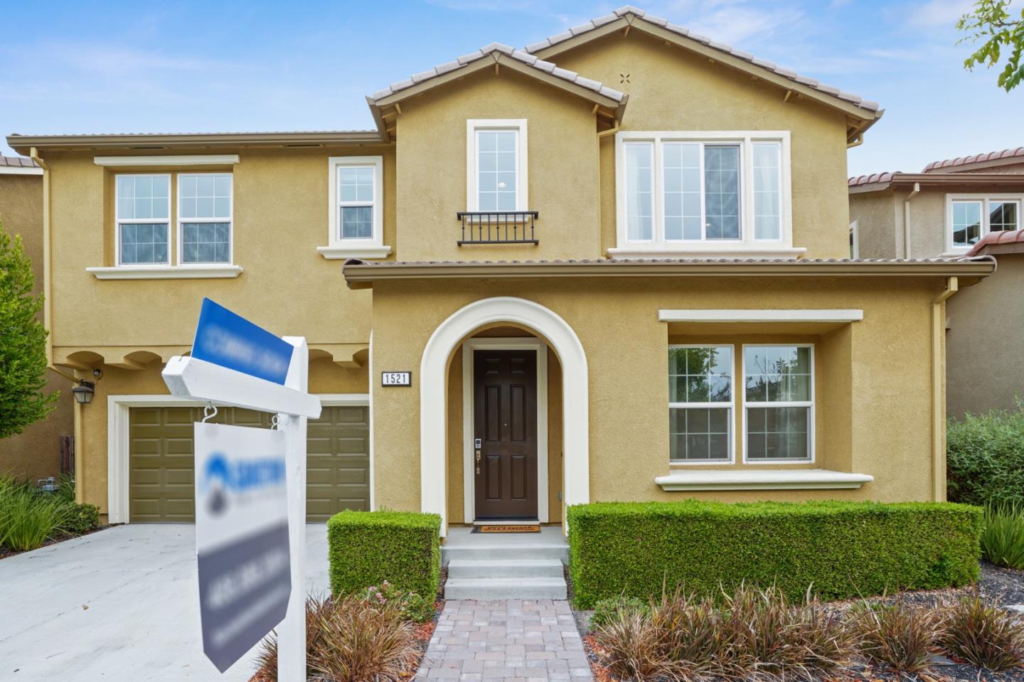 a front view of a house with garden
