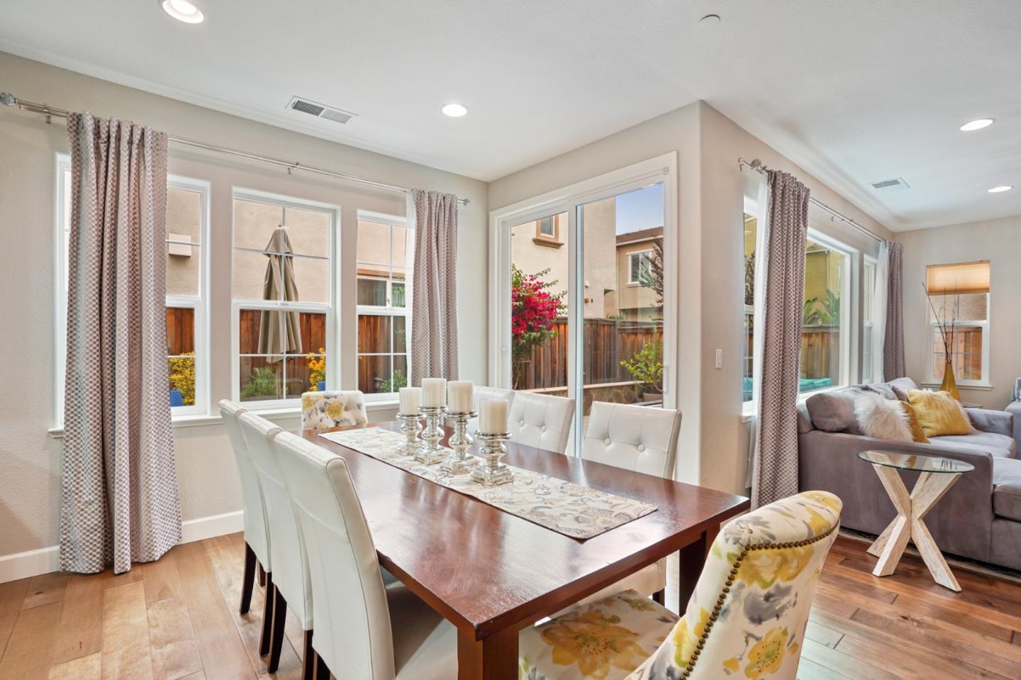 1521 Middle Lane Hayward, CA 94545 - Photo 13 of 34 a dining room with furniture large windows and wooden floor