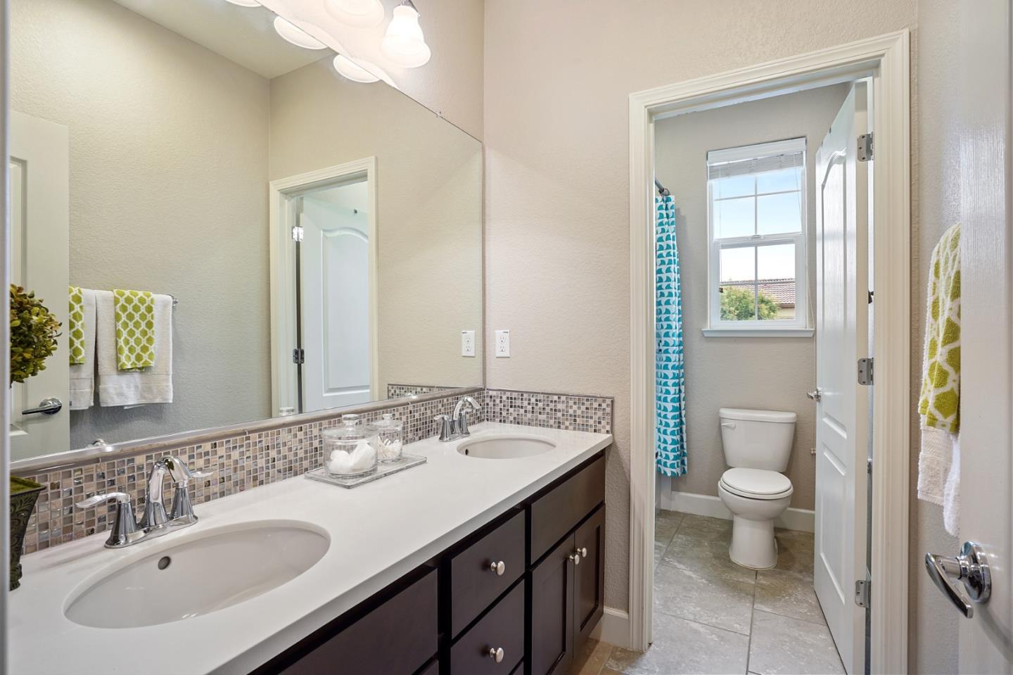 1521 Middle Lane Hayward, CA 94545 - Photo 19 of 34 a bathroom with a sink a toilet and shower a mirror