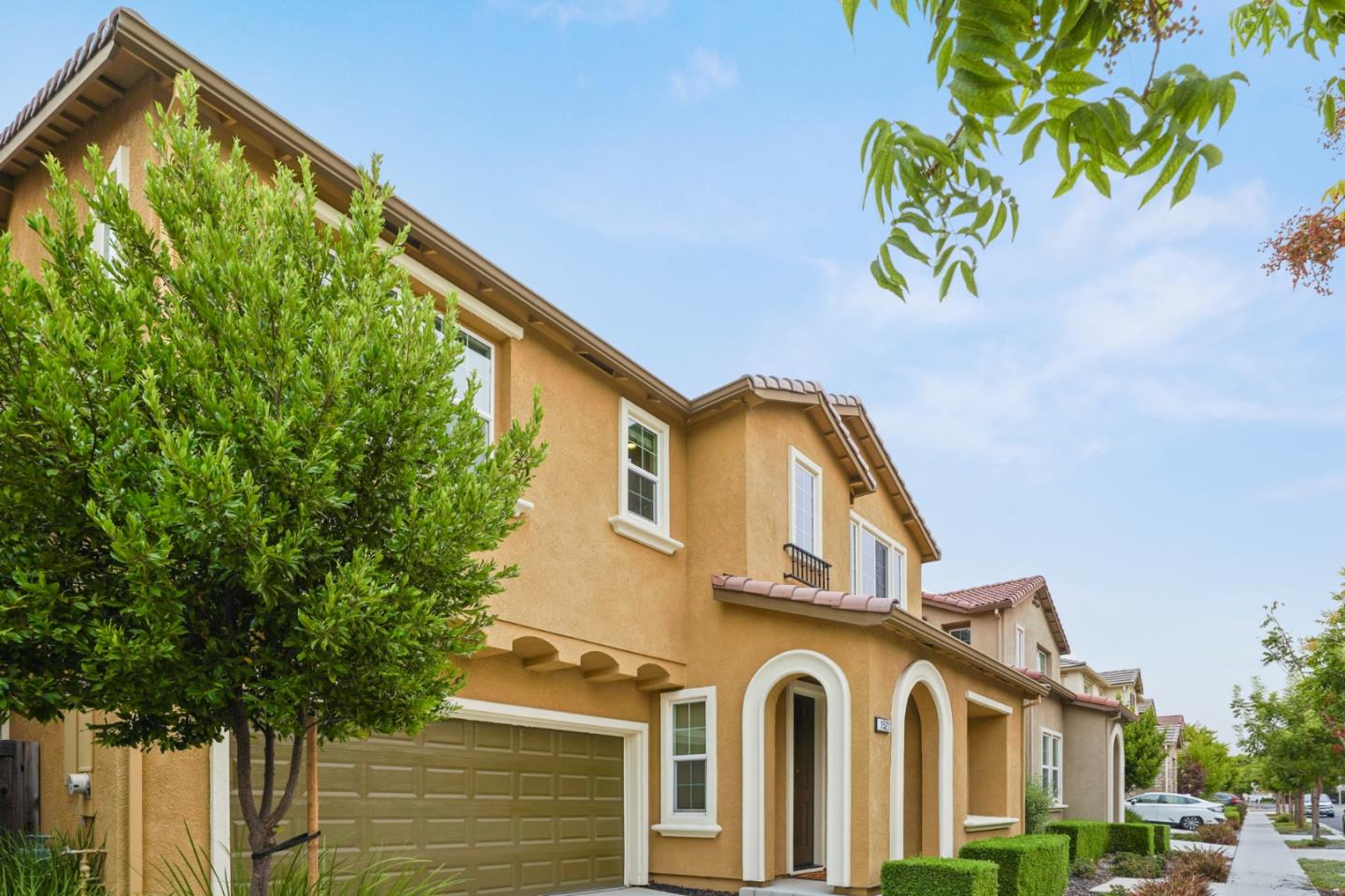 1521 Middle Lane Hayward, CA 94545 - Photo 2 of 34 a front view of a house with a yellow plant