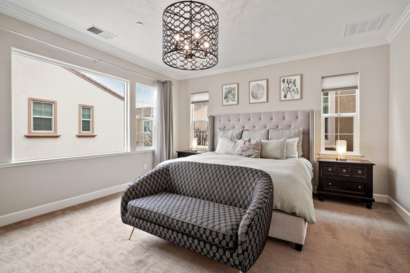 1521 Middle Lane Hayward, CA 94545 - Photo 24 of 34 a bedroom with a bed and a chandelier