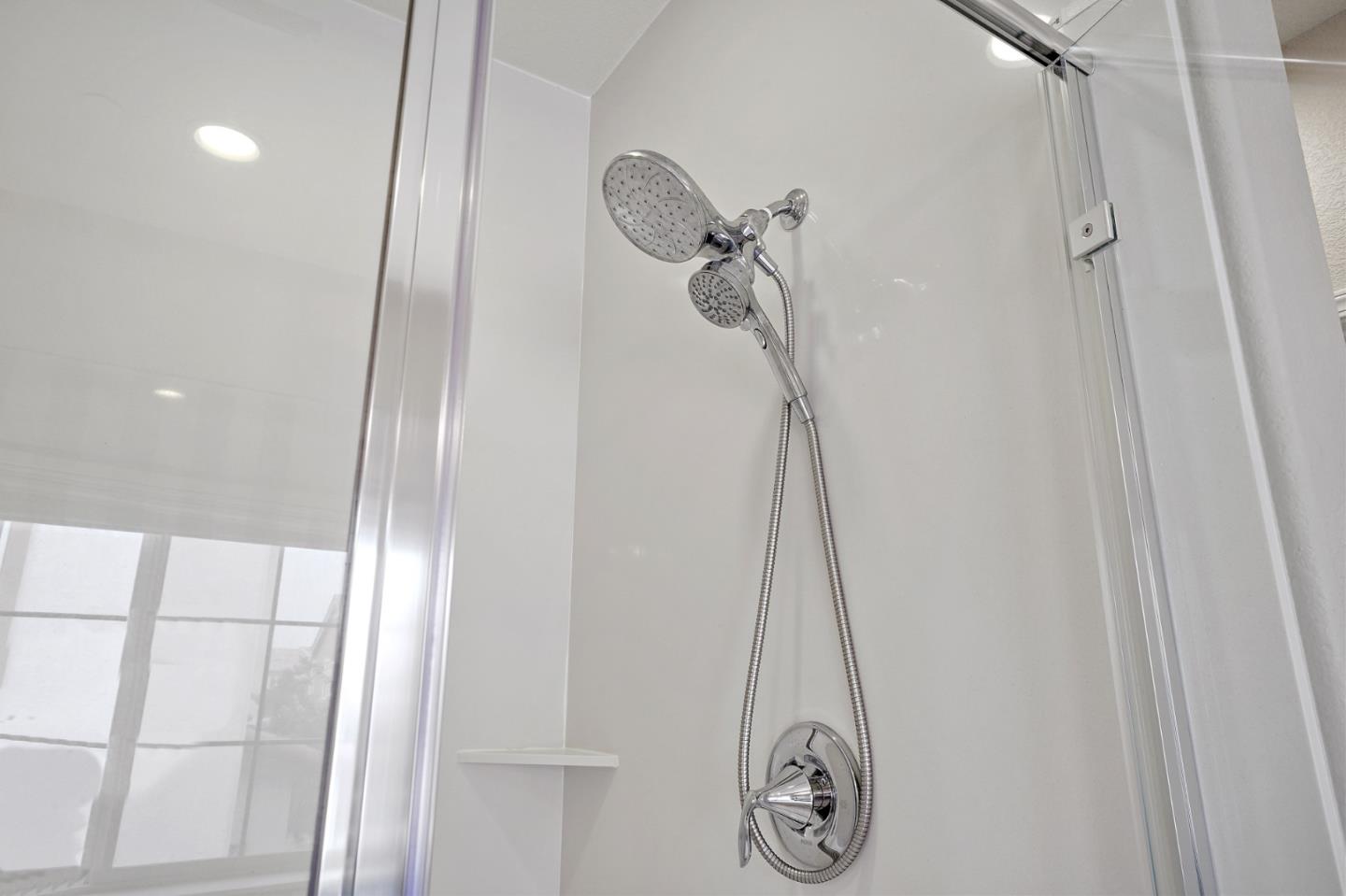 1521 Middle Lane Hayward, CA 94545 - Photo 28 of 34 a bathroom with a shower vanity and a mirror