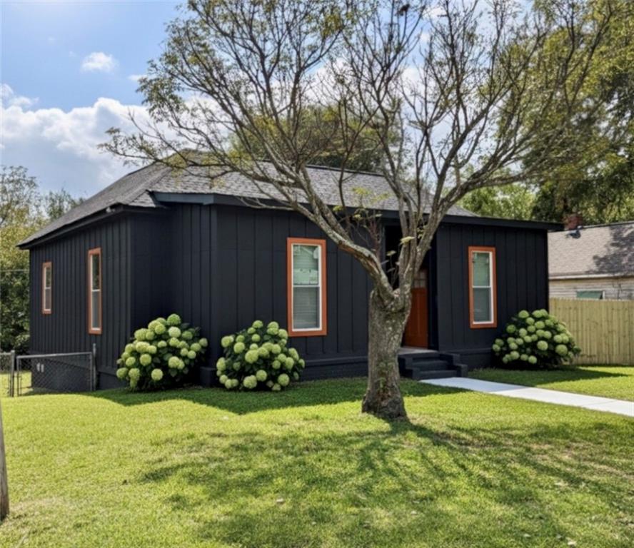 a house with garden in front of it