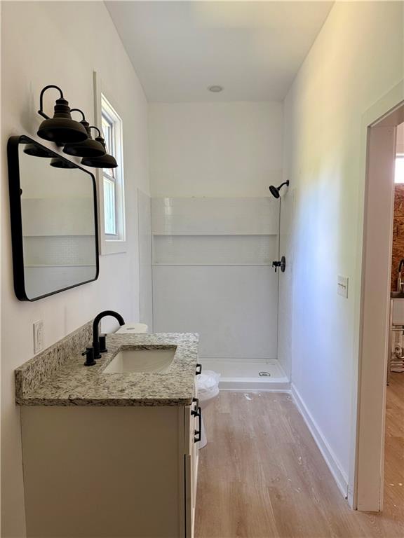 808 Center Street Macon, GA 31217 - Photo 16 of 30 a bathroom with a granite countertop sink and a mirror