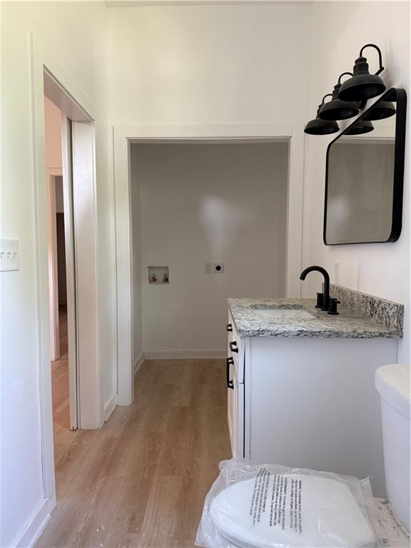 808 Center Street Macon, GA 31217 - Photo 17 of 30 a bathroom with a sink toilet and mirror