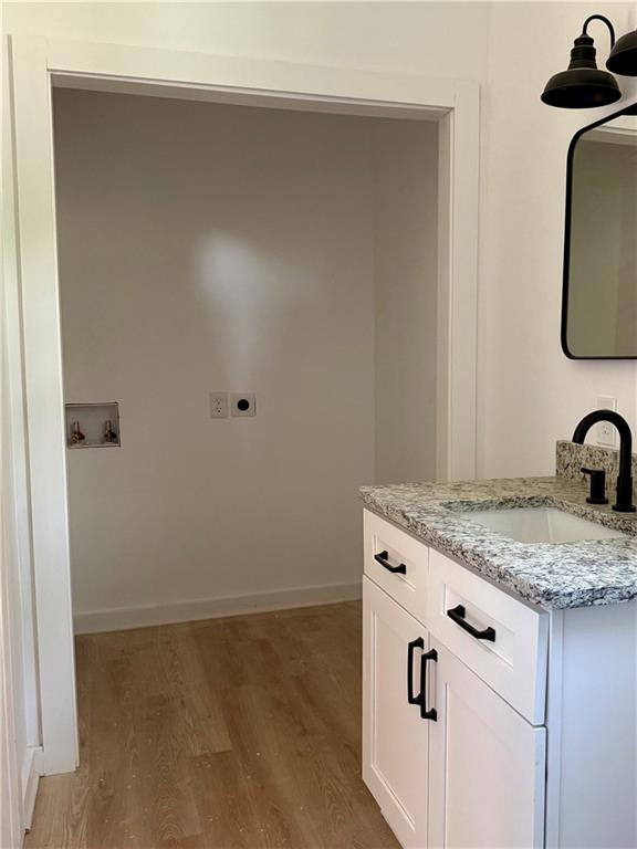 808 Center Street Macon, GA 31217 - Photo 18 of 30 a bathroom with a granite countertop sink and vanity
