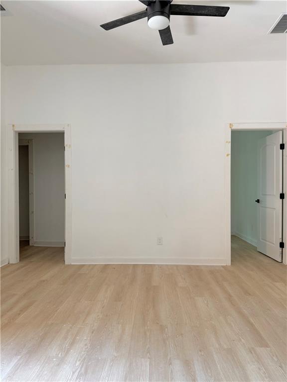 808 Center Street Macon, GA 31217 - Photo 25 of 30 an empty room with a ceiling fan and carpet