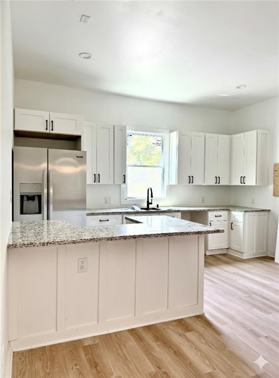 808 Center Street Macon, GA 31217 - Photo 6 of 30 a kitchen with granite countertop a sink and cabinets