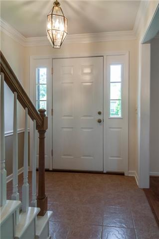 1317 General George Patton Road Nashville, TN 37221 - Photo 3 of 20 Welcoming foyer with tile floor and side lights.