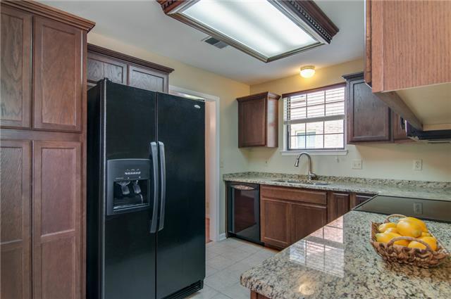 1317 General George Patton Road Nashville, TN 37221 - Photo 7 of 20 Tile floor and granite counters make for easy cleaning.