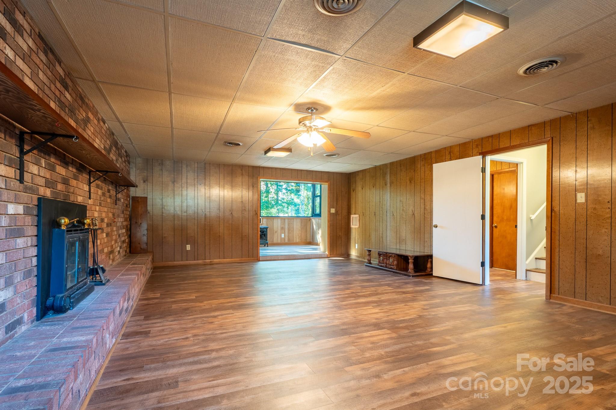3851 Idlewood Acres Road Hickory, NC 28601 - Photo 13 of 34 a view of an empty room with window and wooden floor