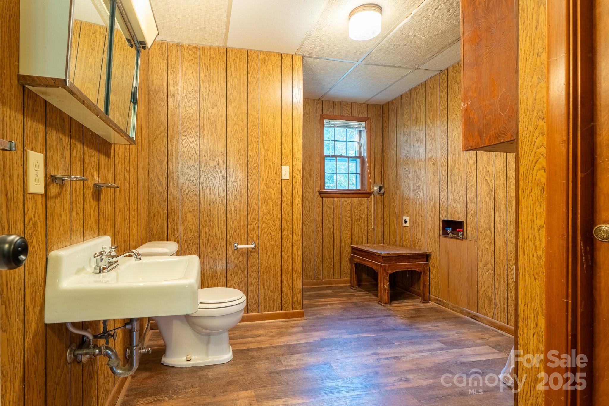 3851 Idlewood Acres Road Hickory, NC 28601 - Photo 14 of 34 a bathroom with a sink a toilet and shower curtain