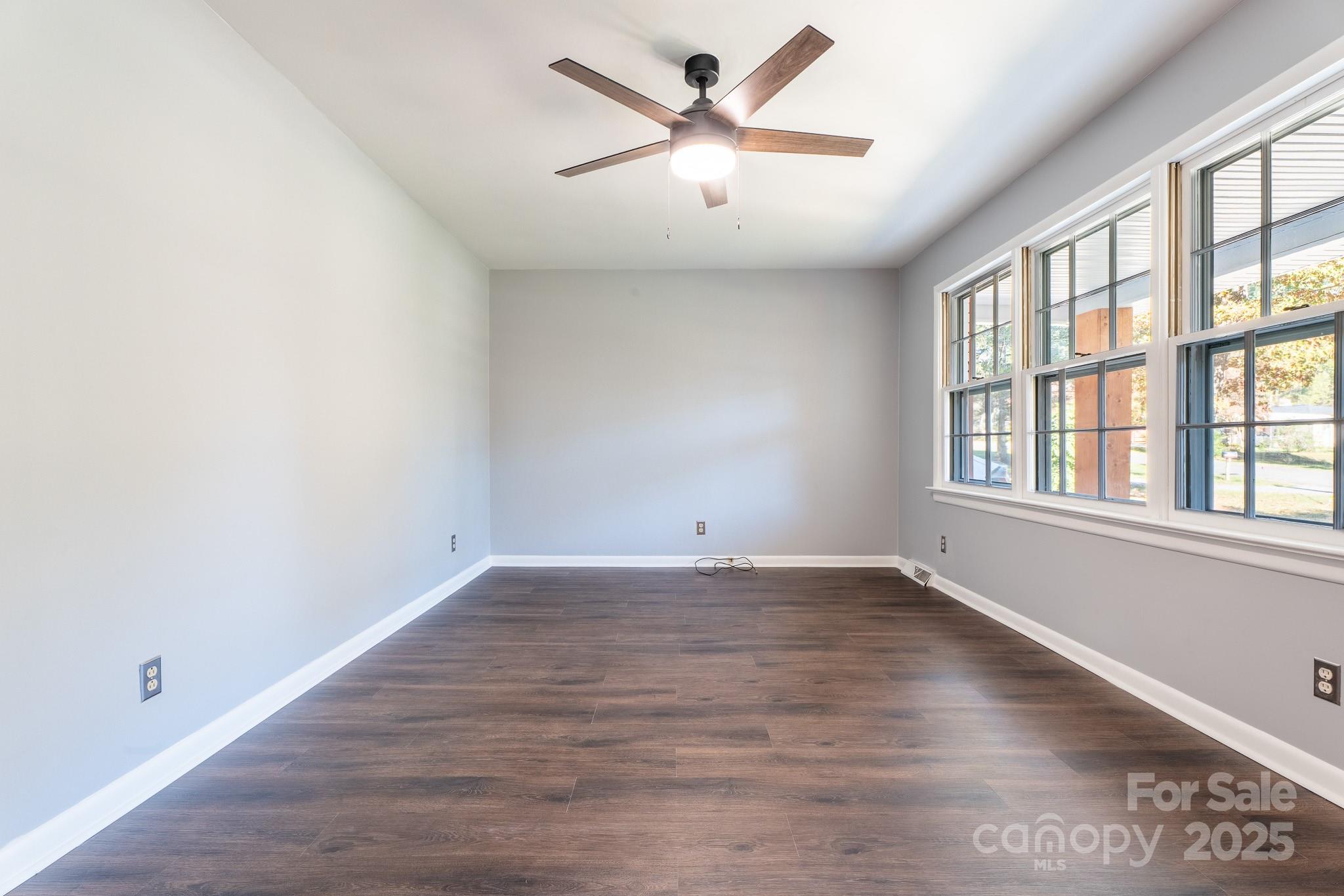 3851 Idlewood Acres Road Hickory, NC 28601 - Photo 18 of 34 an empty room with wooden floor and windows