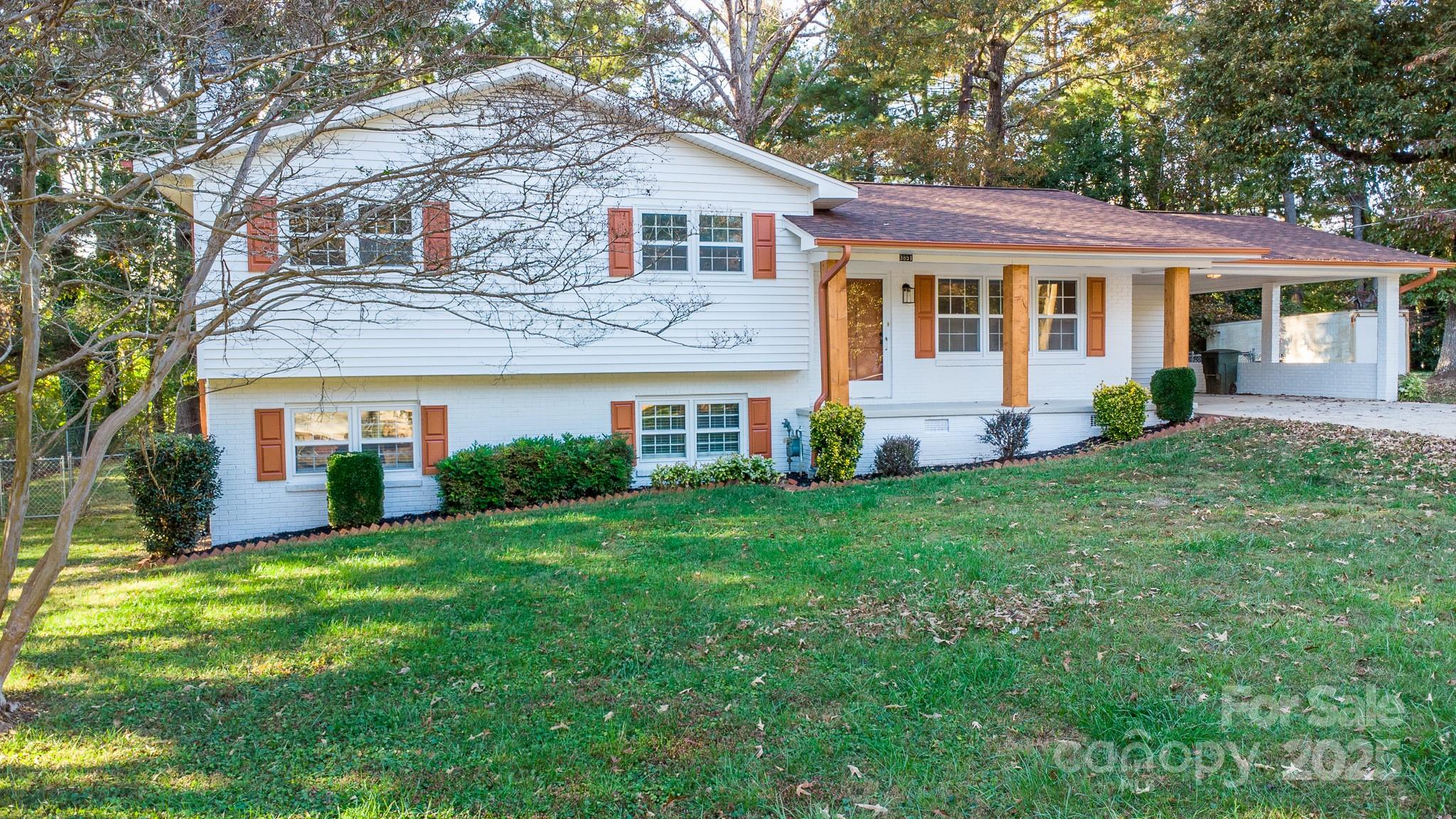 3851 Idlewood Acres Road Hickory, NC 28601 - Photo 2 of 34 a front view of a house with a yard and trees