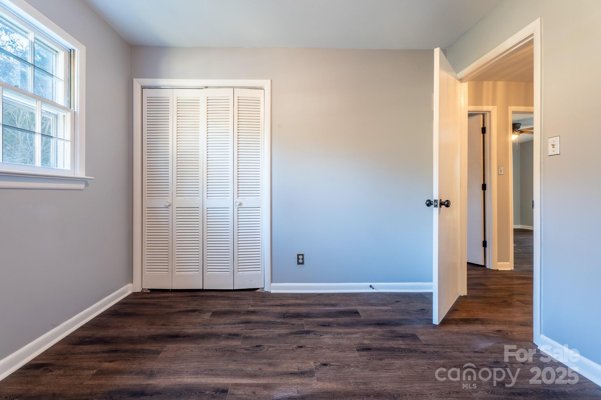3851 Idlewood Acres Road Hickory, NC 28601 - Photo 22 of 34 an empty room with wooden floor and windows