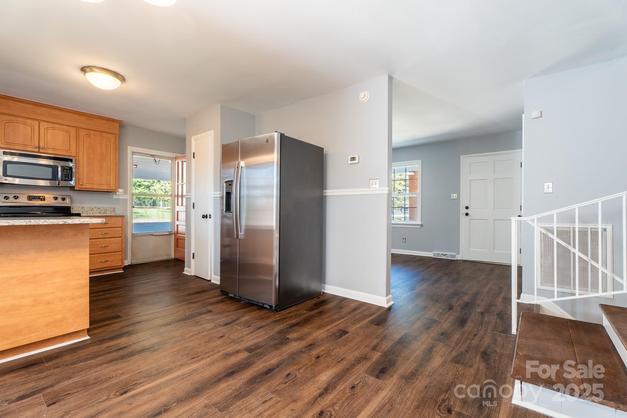3851 Idlewood Acres Road Hickory, NC 28601 - Photo 10 of 34 a kitchen with stainless steel appliances a refrigerator and a stove top oven