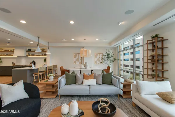 a living room with furniture and a large window