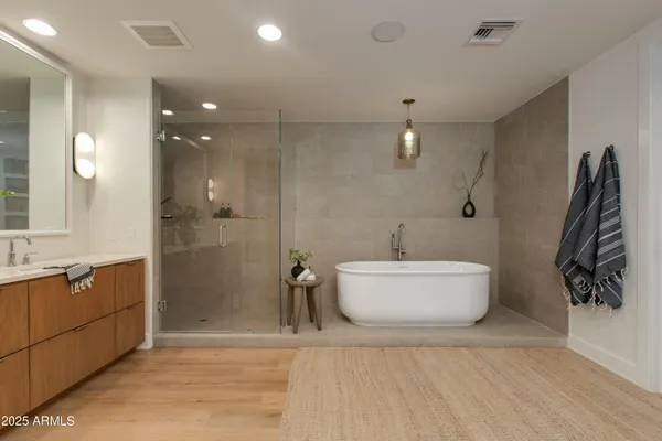 a bathroom with a bathtub and shower