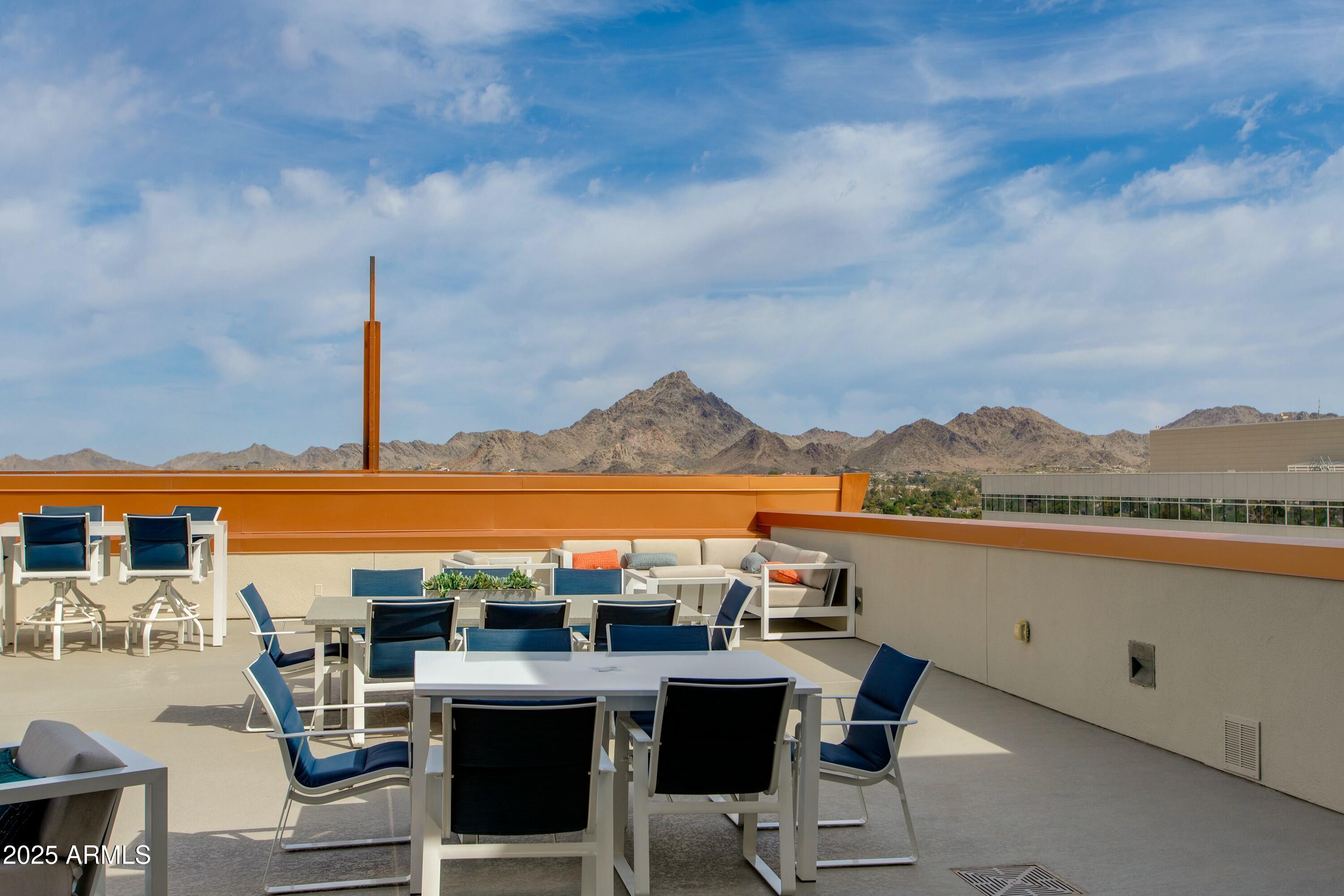 2211 East Camelback Road, Unit 402 Phoenix, AZ 85016 - Photo 19 of 27 a view of a terrace with furniture