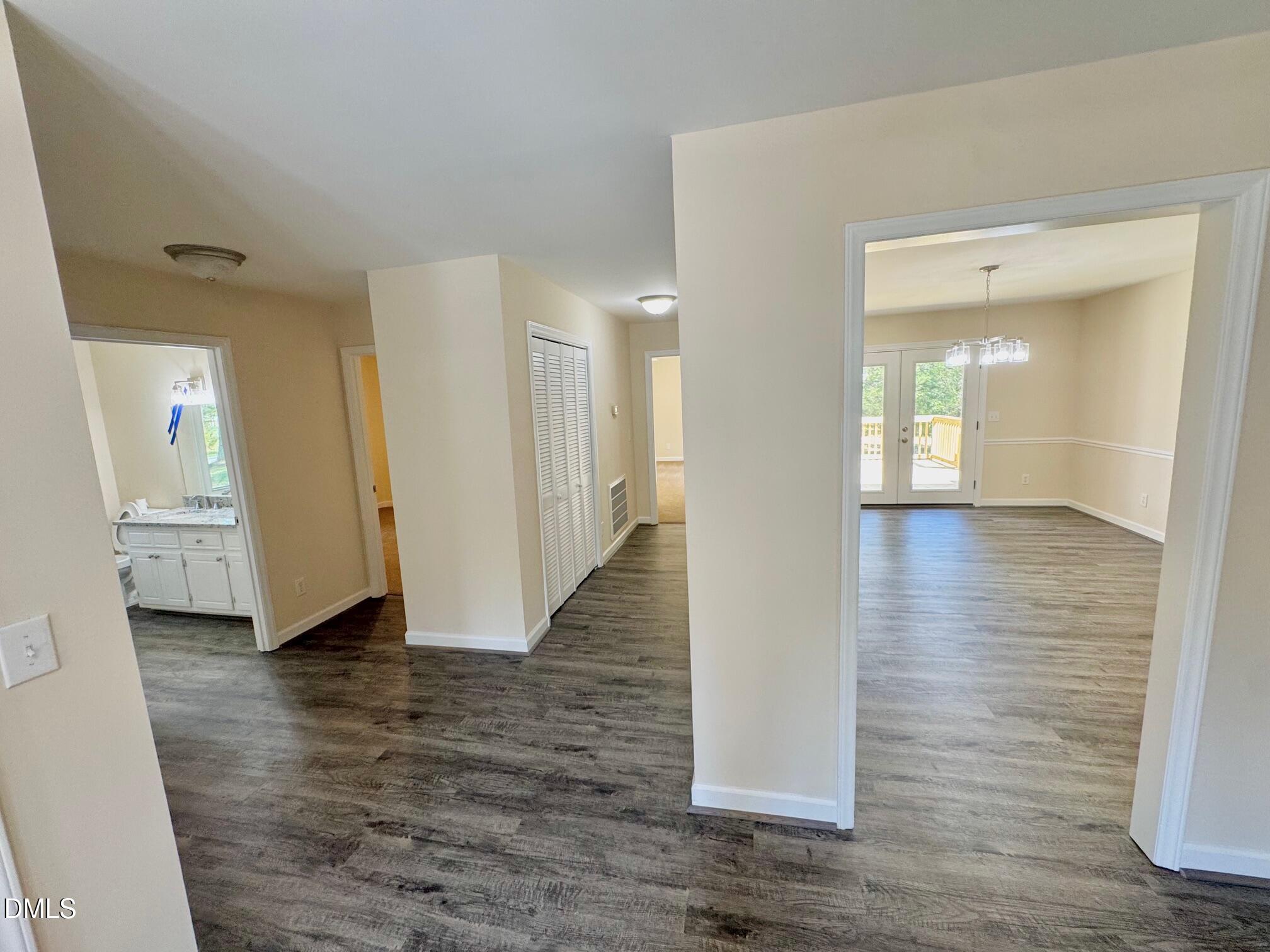 1720 Ross Mill Road Henderson, NC 27537 - Photo 9 of 42 a view of a hallway with wooden floor