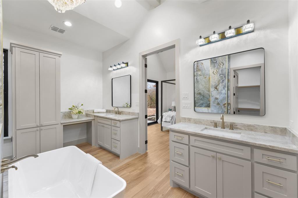 14120 Park Way Log Cabin, TX 75148 - Photo 15 of 40 a spacious bathroom with a granite countertop sink mirror and bathtub