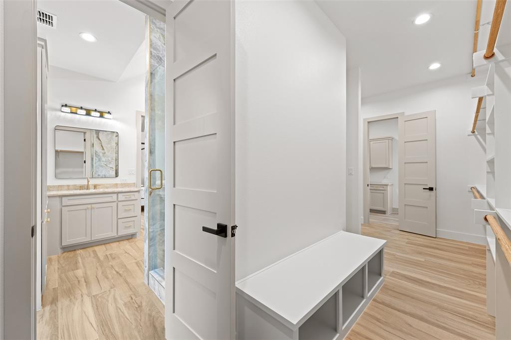 14120 Park Way Log Cabin, TX 75148 - Photo 17 of 40 a room with white cabinets and wooden floor