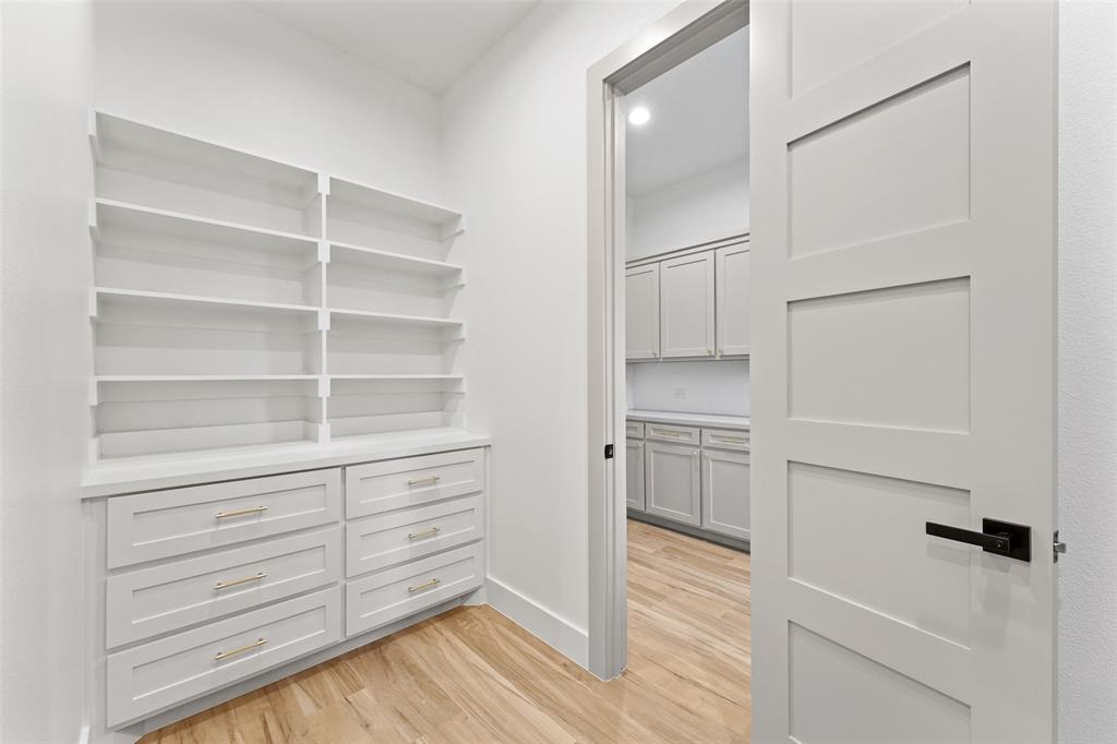 14120 Park Way Log Cabin, TX 75148 - Photo 18 of 40 a view of walk in closet with empty racks