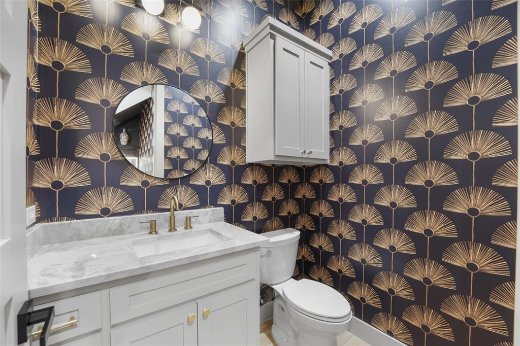 14120 Park Way Log Cabin, TX 75148 - Photo 21 of 40 a bathroom with a granite countertop toilet and sink