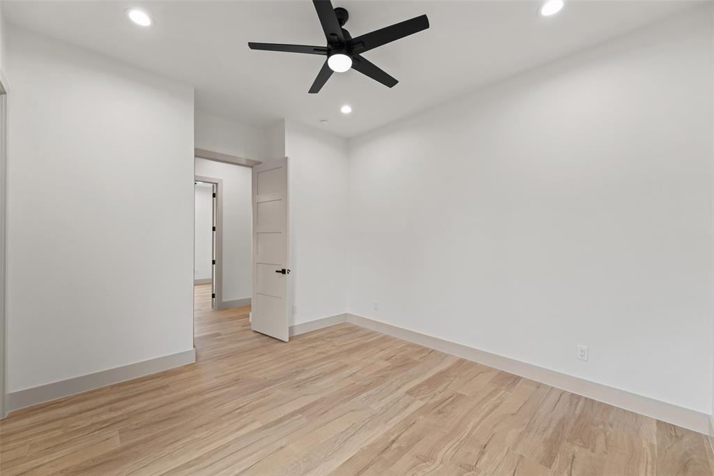 14120 Park Way Log Cabin, TX 75148 - Photo 24 of 40 an empty room with wooden floor and windows