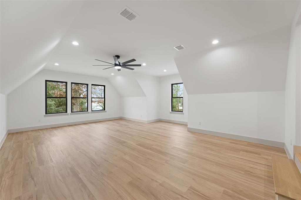 14120 Park Way Log Cabin, TX 75148 - Photo 29 of 40 a view of an empty room with a window and wooden floor