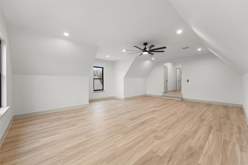 14120 Park Way Log Cabin, TX 75148 - Photo 30 of 40 an empty room with wooden floor and a ceiling fan