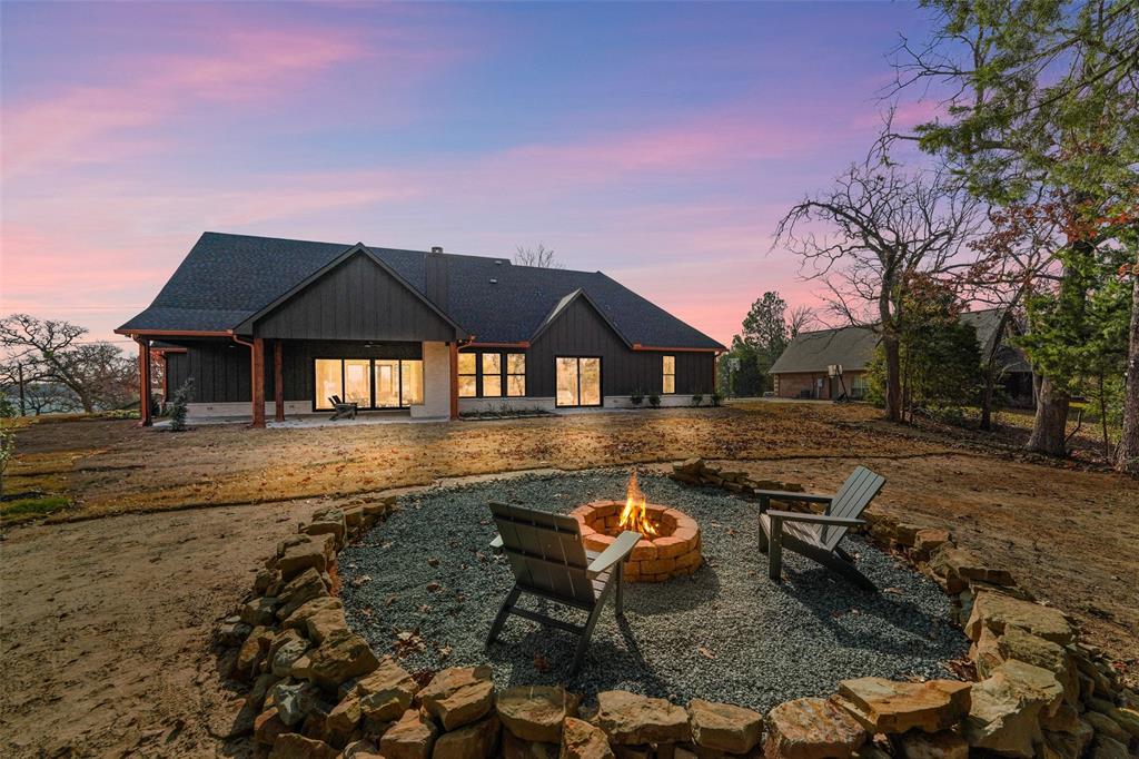 14120 Park Way Log Cabin, TX 75148 - Photo 35 of 40 a backyard of a house with table and chairs